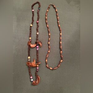 Pair of Hawaiian necklaces made of seeds, wood and beads